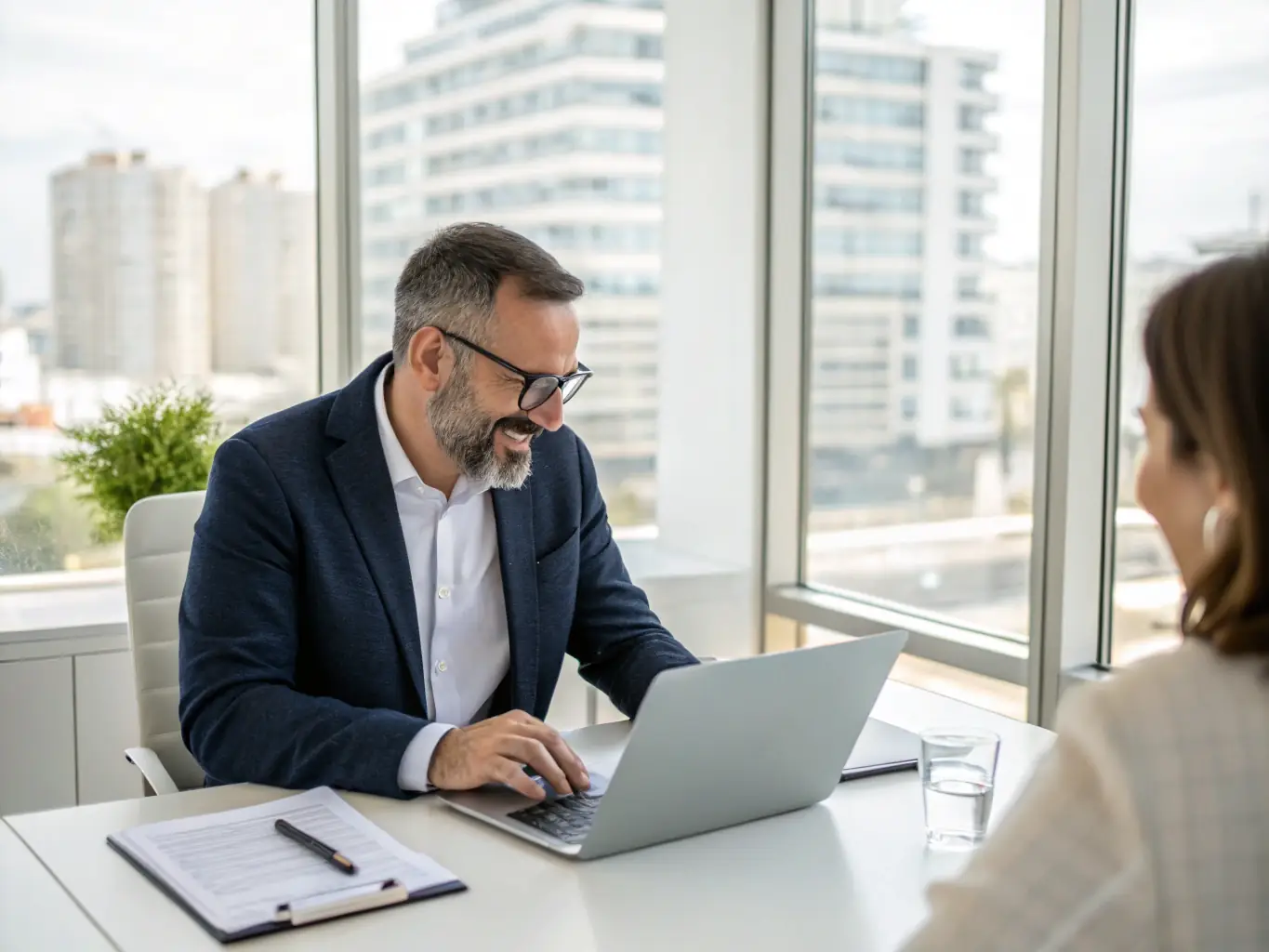 A real estate agent using a tablet to review digital marketing analytics, showcasing Ignite Scope's digital marketing expertise.